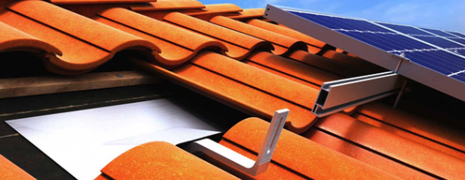 Close up view of solar panel mounting equipment on a clay tile roof